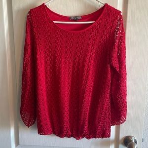 Women’s size medium red half sleeve blouse.